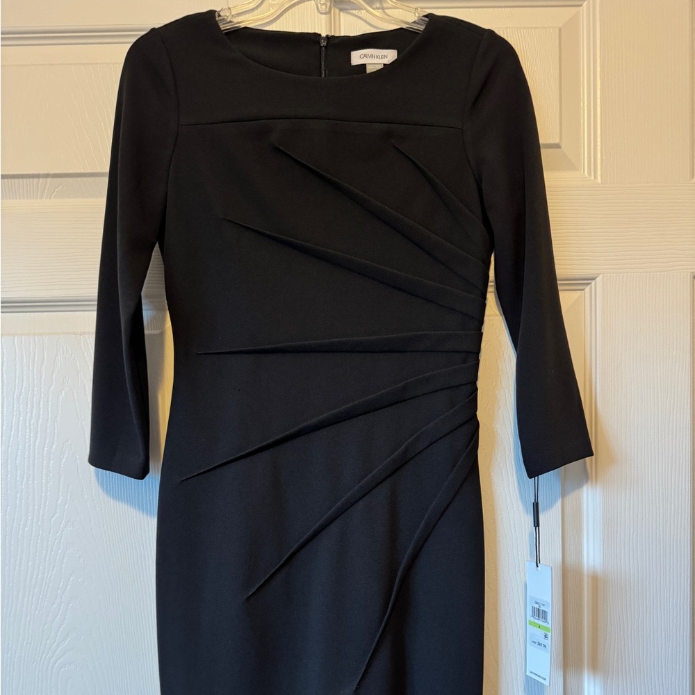 NWT Calvin Klein black dress, size 4. 
94% Polyester 6% Spandex